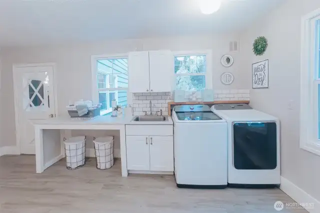 main floor large laundry/crafting space