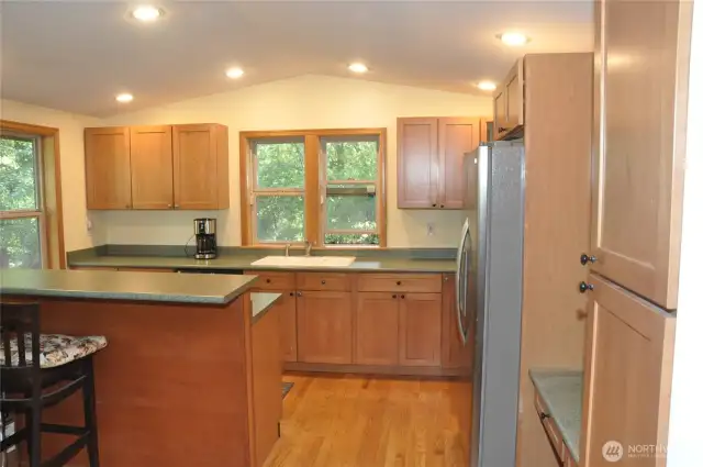The spacious kitchen is designed for gathering—ideal for preparing meals for a crowd or hosting memorable get-togethers. Featuring an eating bar, a casual dining area just off the kitchen, and a separate formal dining room, this home offers endless options for entertaining and everyday living