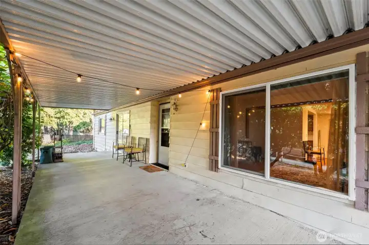 Covered patio entrance on left side of home.