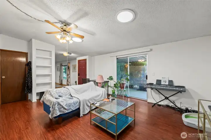 Family room/2nd living room has generous light with solar tube and light through the glass slider.