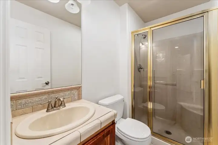 Main level bathroom with shower.