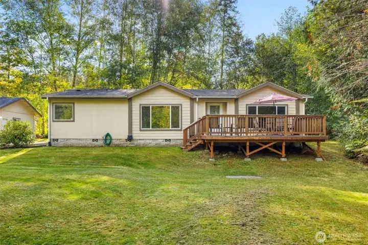 Front of house, block foundation, large deck