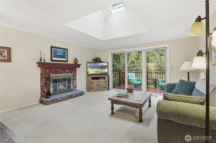 Open living room with gorgeous skylights letting in tons of natural light!
