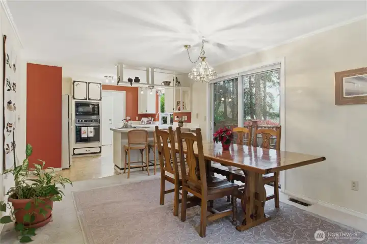 Very large open dining room with a slider to the side deck. Being an end unit, this is one of the few units in Hiddenwood West with two decks for outside living. There is also no neighbor outside this deck... just a territorial greenspace area!