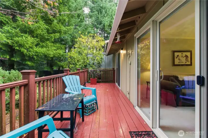Another view of the back deck with sliders from the primary bedroom and the living room
