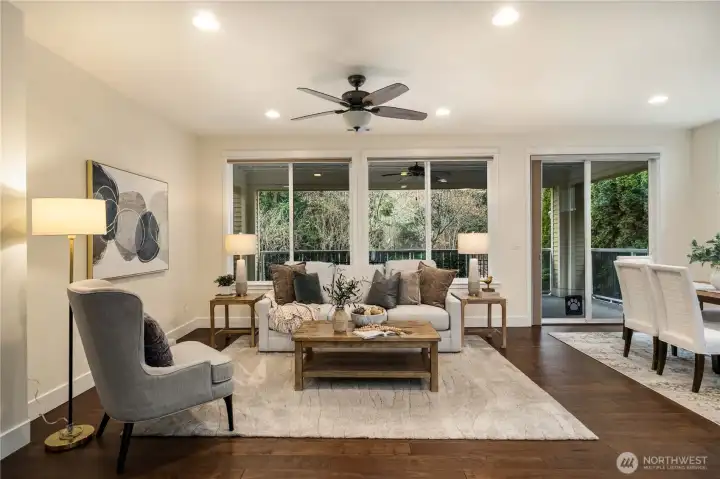 Oversized windows allow light to stream in on the Southern facing lot.  Beautiful millwork, fresh interior paint, gleaming Engineered hardwoods and generous open floorplan that lives large!
