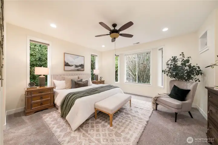 Generous primary bedroom with great nature views from all windows!  Custom window covering, wrapped windows and upgraded trim.