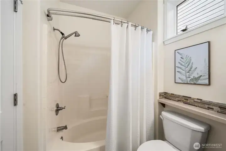 Guest bath with shower & tub.