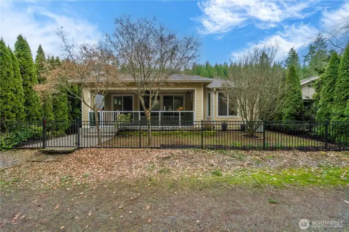 Prime location offers easy access to one of the 40+ miles of walking/running trails that weave throughout Tehaleh.  Mature arborvitae provides a plethora of privacy from your wonderful neighbors!