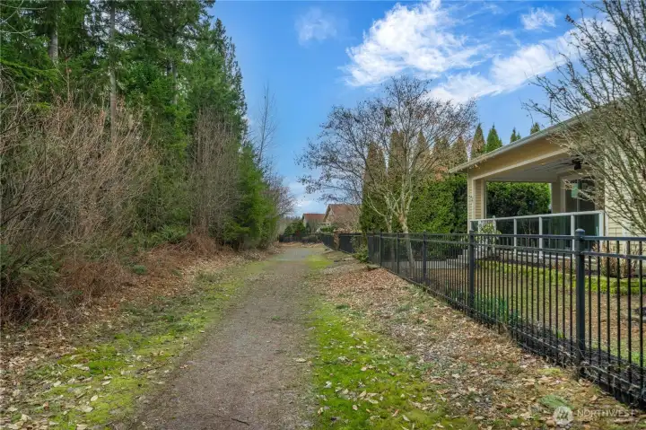 Easy trail access through gate in your back yard!