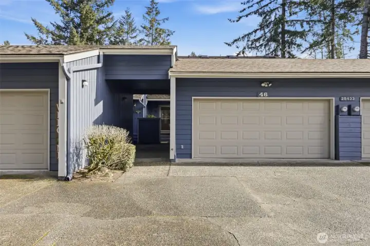Front view of breezeway and 2 car garage.