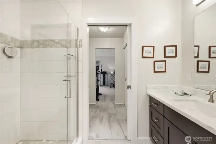 Beautifully updated luxurious bathroom. Quartz countertops, new fixtures, lighting and tile. Huge walk in shower.