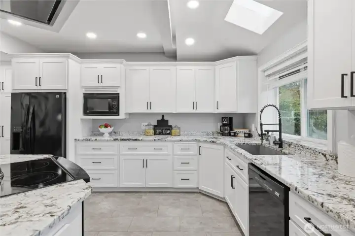 Light-filled kitchen with skylights and expansive counter space
