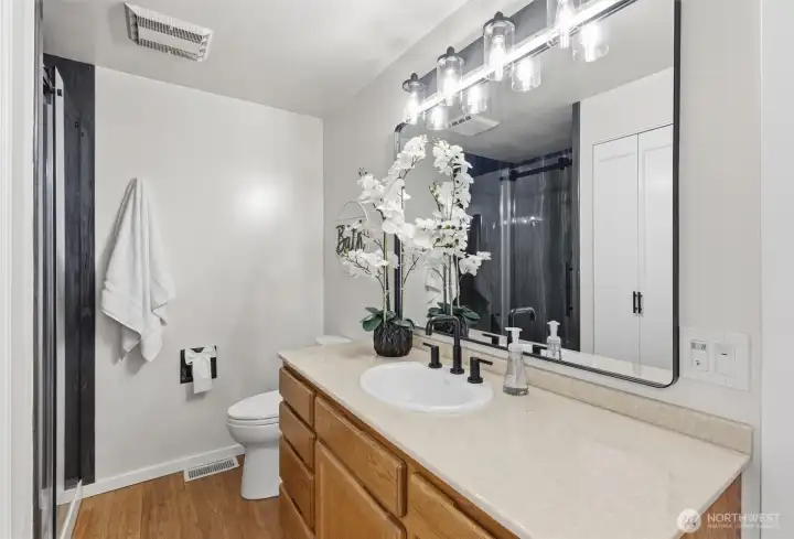 Updated hallway bathroom with modern finishes and clean design