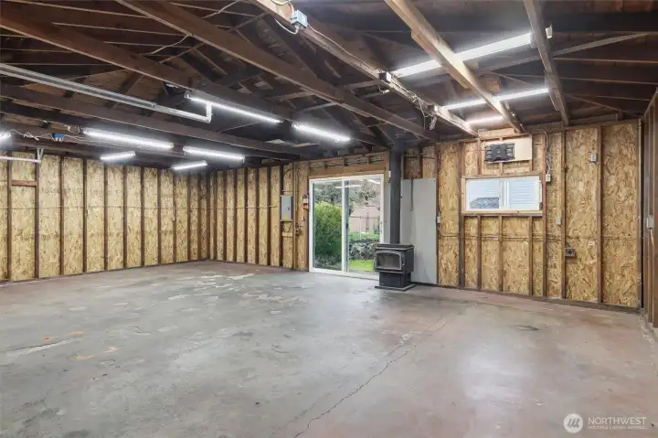 Massive garage with shop space and wood-burning stove