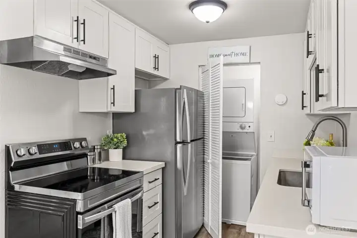 Laundry in closet next to the kitchen.