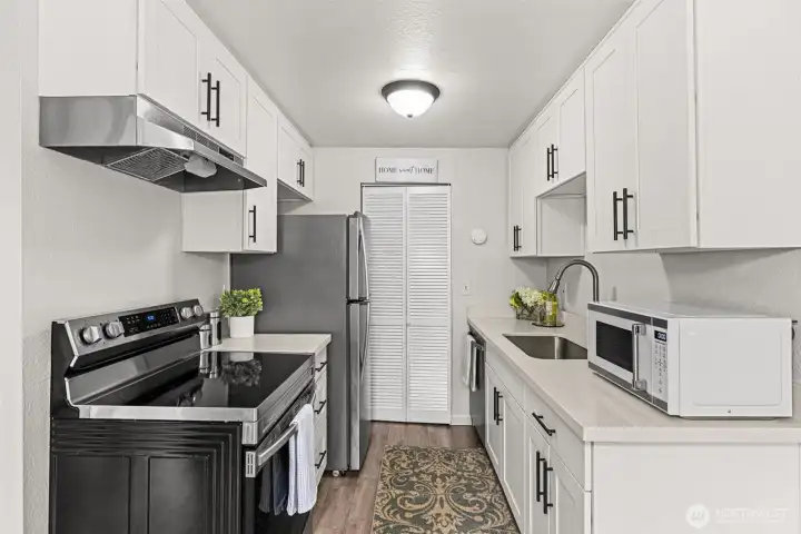 White cabinets and quartz counter tops.