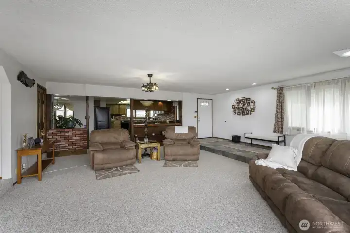 Expansive gathering space ideal for entertaining, relaxing, or multiple seating arrangements.