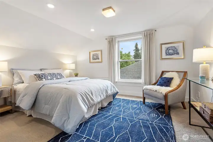 Generous primary on upper floor, freshly painted, facing south, charming and spacious.