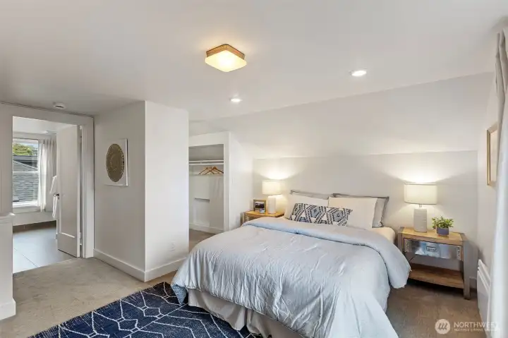 Generous primary ensuite, thoughtfully created from two original bedrooms in 2015, features a walk-in closet, spacious bedroom layout and dreamy ensuite bathroom.