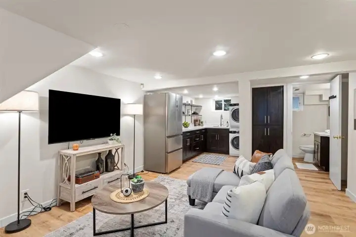 Welcome to the beautiful lower level, a versatile space offering exceptional flexibility as an extension of the main living area, private guest accommodations, MIL suite, or potential rental space.