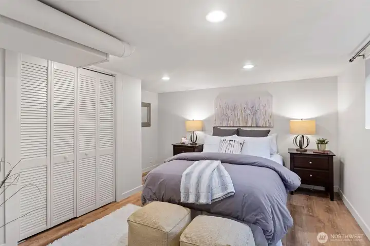 Updated bedroom with new flooring, generous closet space, and an egress window, creating a bright and functional retreat.