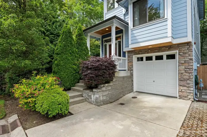 Two car tandem garage with shop space and storage, plus driveway parking and guest parking! HOA maintains front yards.