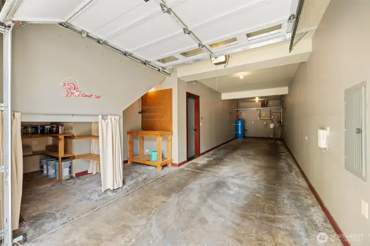 Wow! This garage is spectacular! Two cars plus shop space and additional storage.