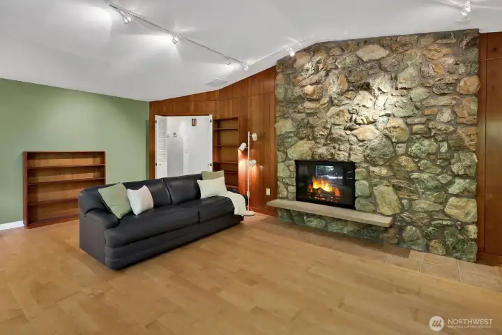 Cozy up to the stone wood burning fireplace with tile surround that matches the entry and hall tile.