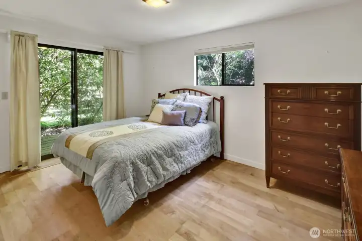 4th bedroom with sliding door to back covered deck and walkway.