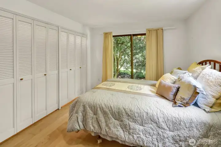 4th bedroom with lighted wall of closet space.
