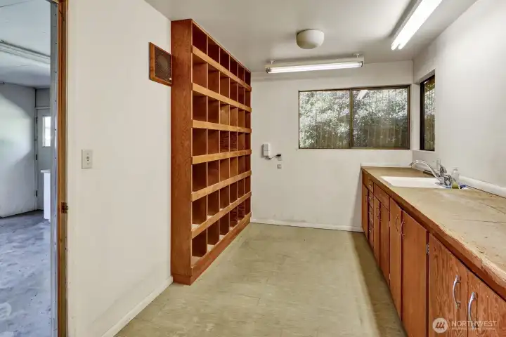 Utility room with furnace and hot water tank, built in vacuum.
