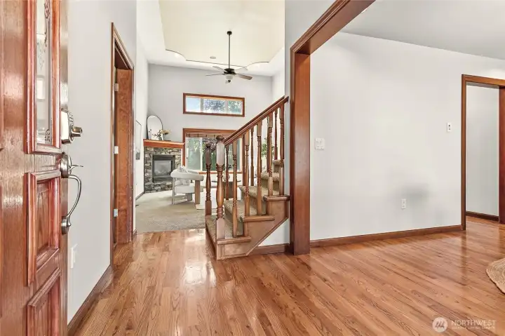 Beautiful hardwood floors welcome you into foyer with extra tall ceilings Beautiful hardwood floors welcome you into foyer with extra tall ceilings