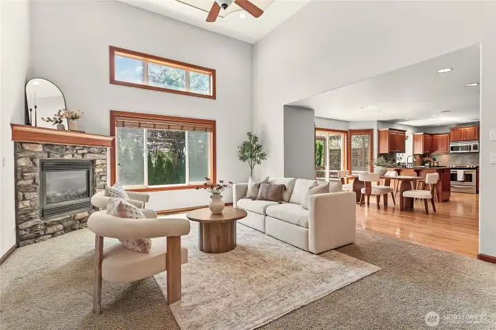 Great room with cozy gas fireplace, 2 story tray ceiling, built-in speakers open to dining room Great room with cozy gas fireplace, 2 story tray ceiling, built-in speakers open to dining room