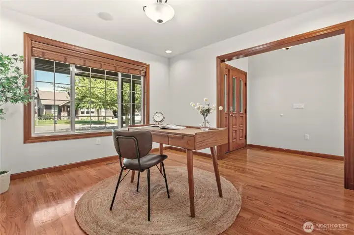 Just off front entry is spacious den/office/formal dining flex room with nice large window and hardwood floors Just off front entry is spacious den/office/formal dining flex room with nice large window and hardwood floors