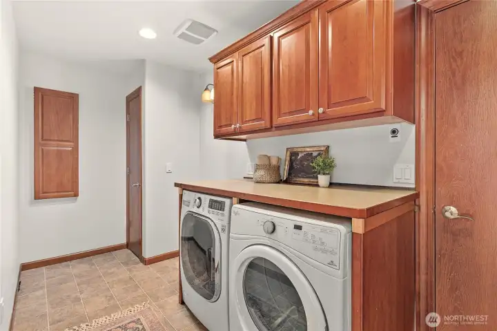 Utility room with garage access just behind kitchen with closet & cabinet storage. W/D included Utility room with garage access just behind kitchen with closet & cabinet storage. W/D included