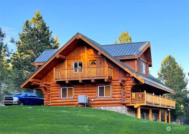 A GORGEOUS HAND-HEWN LOG HOME. FULLY CHINKED INSIDE & OUT. SITUATED IN THE LOWER PORTION OF THIS SPECTACULAR 49.85-ACRE MOUNTAINOUS PROPERTY.