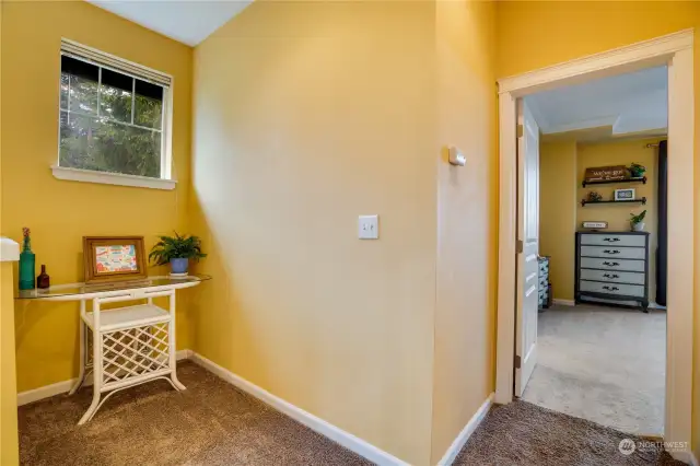 A cozy little nook in the upstairs landing. This floor features two primary suites and the laundry room.