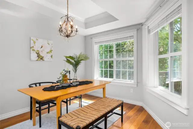 dining with concave ceiling and chandelier