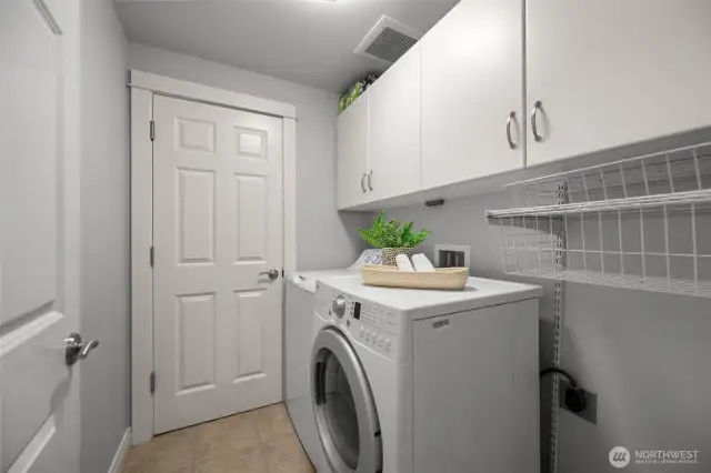 Laundry room with storage closet