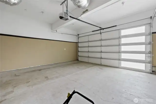 Finished garage with good light and workspace.