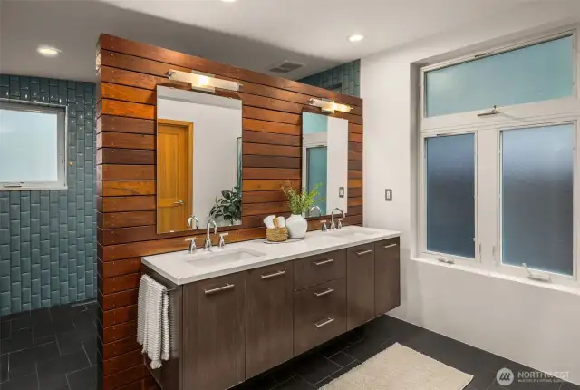 Primary bath features radiant heated floors, walk-in ceramic shower with a soaking tub.
