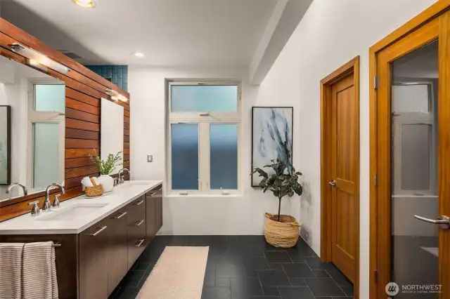 Primary bath features radiant heated floors, walk-in ceramic shower with a soaking tub. There is a build out for a sauna as well.