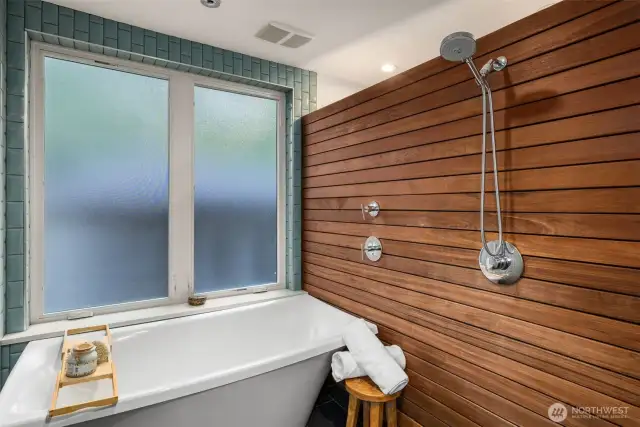 Soaking tub fills from the ceiling spout.