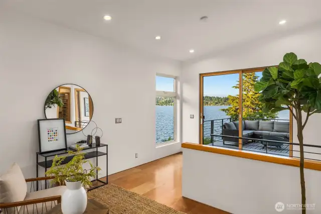 Upper level flex space features cork flooring, sliders out to the deck and french doors.