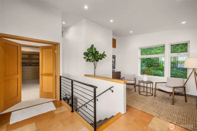 Upper level flex space features cork flooring, sliders out to the deck and french doors.