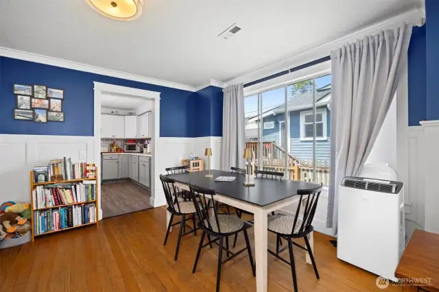 The dining area gets so much natural sunlight from the large windows.