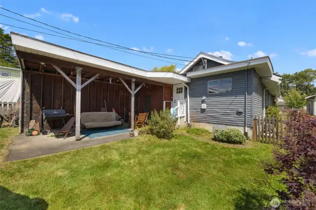 Another view of the rear yard and the carport.