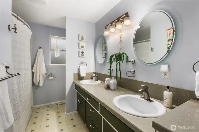 There is plenty of space in the full bathroom which has a dual sink vanity and bathtub