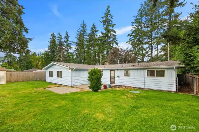 The fully fenced, spacious backyard is perfect for entertaining and enjoying those sunny summer days
